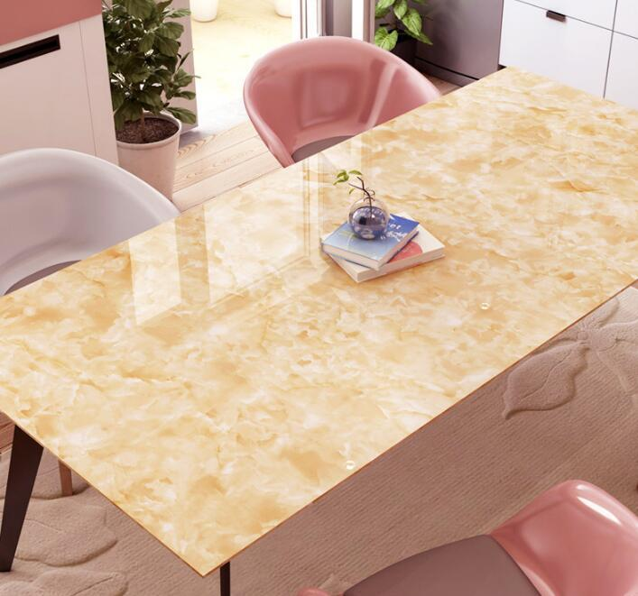 Self-adhesive contact paper on dining tables.