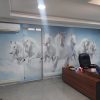 Seven white horses on light blue wallpaper